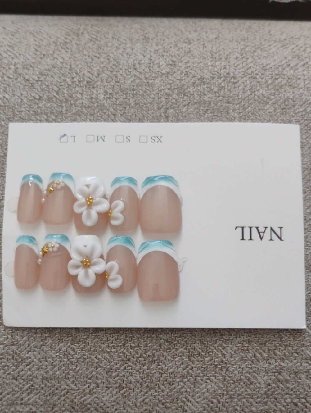Nude Press-On Nails with Teal French Tips & White 3D Flowers